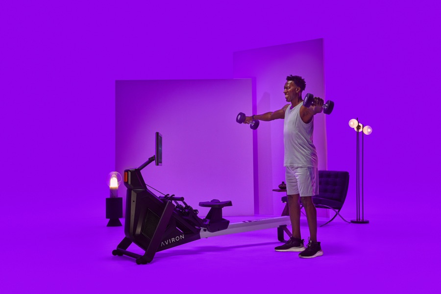 Athlete rowing on Aviron showing full body engagement in legs, core, back, and arms